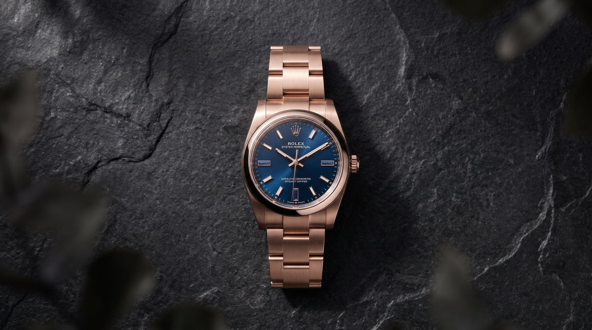 Rose gold Rolex Oyster Perpetual with blue dial on dark slate, representing value retention in luxury watches